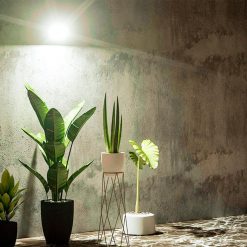 small outside security light shining on balcony of apartment building