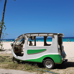 Solar tuk-tuk parked on a beach in Thailand