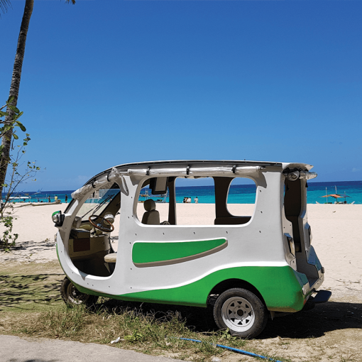 Solar tuk-tuk parked on a beach in Thailand