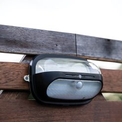 Solar light mounted on fence