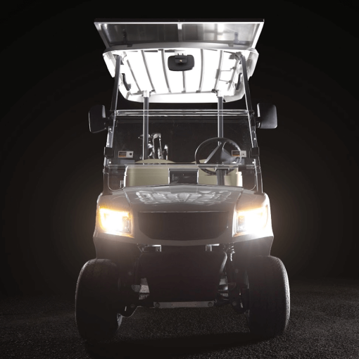 Front view 2 seater golf cart with headlights on